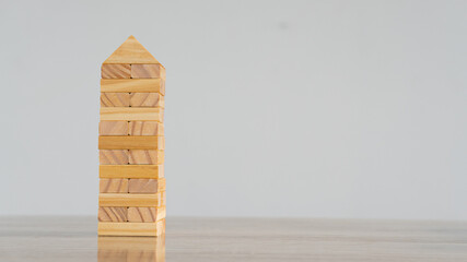 Wooden blocks isolated on white background with clipping path wood cube arrange in a pyramid shape, business concept