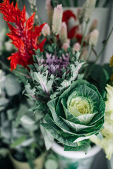 Flower show in the store. Ornamental cabbage for making bouquets.