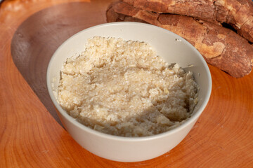 Coarse cassava flour porridge usually served with milk and sugar as a energetic breakfast in Africa