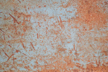 The steel plate has scratches and rust.