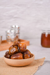 Juicy dates on white and bright background. Copy space, selective focus .