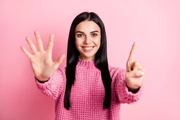 Fotobehang Photo of adorable person toothy smile arms fingers counting showing six isolated on pink color background © deagreez