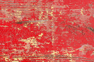 Obraz premium Old painted wood. Cracked paint. The wooden surface is red.