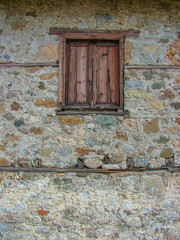 Wooden window of an old stone farmhouse in Turkey. In the vicinity of Antalya