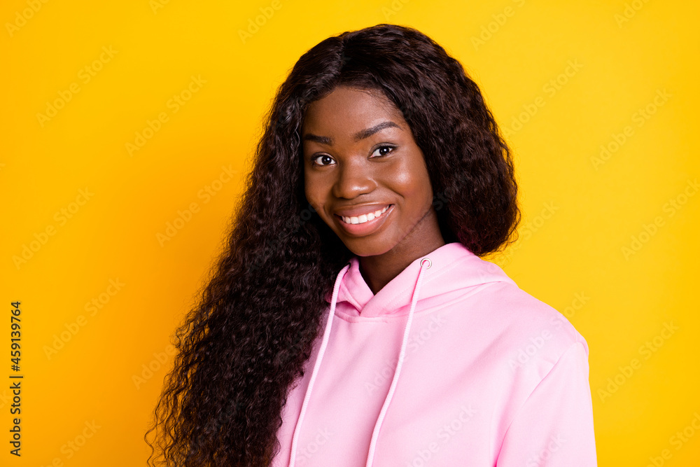 Sticker Photo portrait of african american woman smiling isolated on vivid yellow colored background