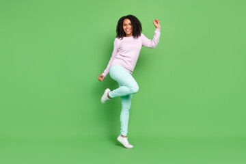 Full body photo of millennial brunette lady dance wear sweater pants sneakers isolated on blue background