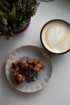 coffee, plum pie and flowers. heather. autumn morning