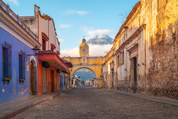 Fototapeta na wymiar Agua volcano and Santa Catalina arch at sunrise, Antigua city, Guatemala.