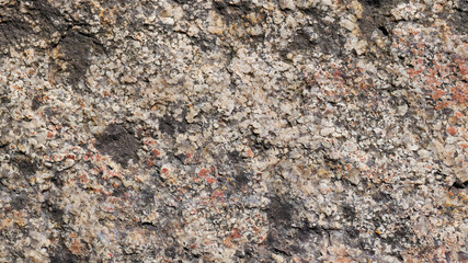 Granite surface. Texture of granite stone. Cracked natural stone surface. Copy space