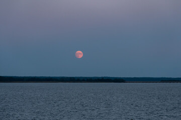 Harvest Moon Rises over the Northern Neck above the Rappahannock River in Tappahannock, Virginia part of the Middle Peninsula
