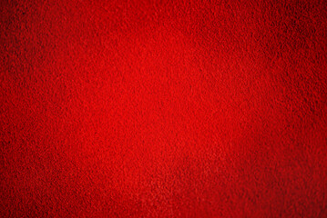 Fototapeta premium Natural leather of red color. Suede as a background.