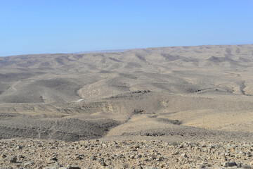 Mountain landscape, desert. Makhtesh Ramon Crater in Negev desert, Israel. Stony desert panoramic view. Unique relief geological erosion land form. National park Makhtesh Ramon or Ramon Crater