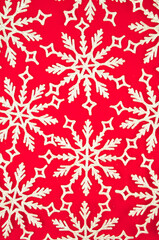 White snowflakes on red background copy space