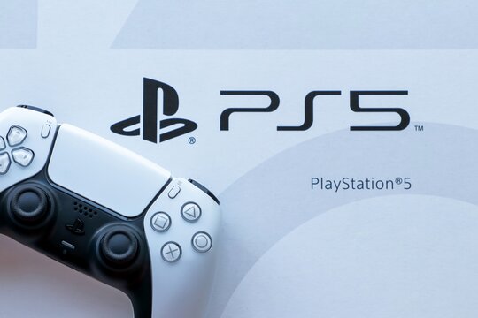 Bangkok, Thailand - February 14, 2021 : Playstation 5 DualSense wireless controller on the box with PS5 logo, New Sony gaming console.