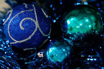 Blue Christmas balls on a background of blue tinsel