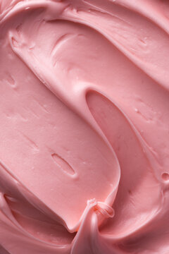 Pink icing frosting close up texture