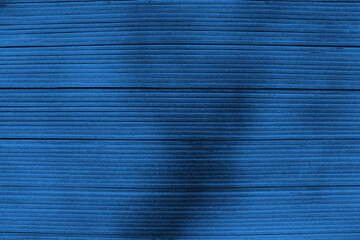 Blue striped background. Abstract dark blue textured background.