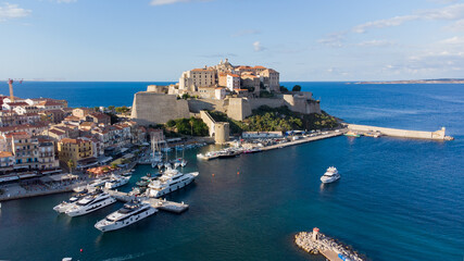 Fototapeta na wymiar Aerial view of the Citadel of Calvi in Upper Corsica - French maritime stronghold in the Mediterranean Sea with defensive walls