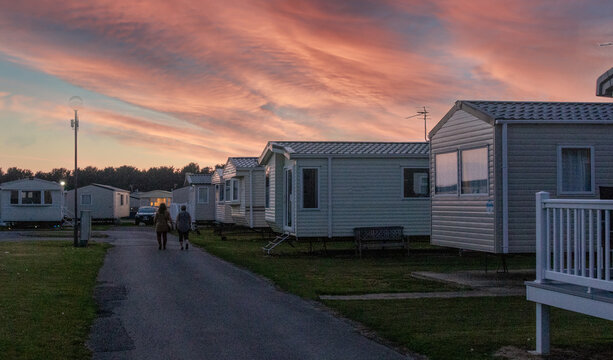 sunset over the mobile homes of a holiday park