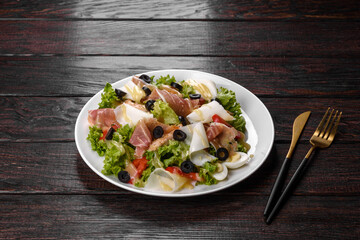 Delicious fresh salad with bacon for the festive table