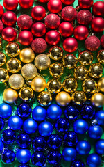 colored Christmas tree toys are scattered on the table