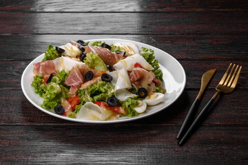 Delicious fresh salad with bacon for the festive table