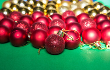 colored Christmas tree toys are scattered on the table