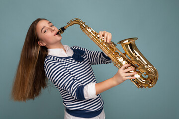 Side-profile photo shot of fascinating cute positive happy brunet little girl wearing casual...