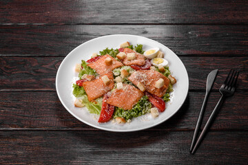 Delicious fresh salad with red fish for the festive table