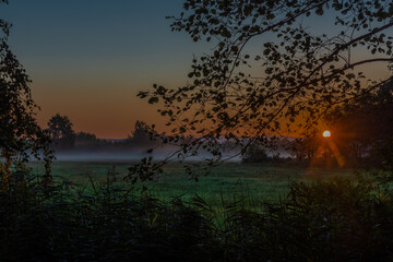 Pasture land with morning fog with sunrise light in south Bohemia