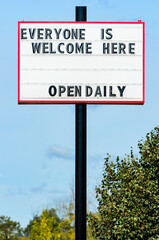 Fototapeta premium Exterior retail open sign during the pandemic restrictions illustrating equity.