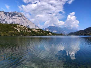 Dro, Trento: Clouds reflecting in the clear waters of Lake Cavedine, Trentino Alto Adige