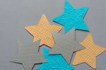 blue, yellow, and silver gray paper stars