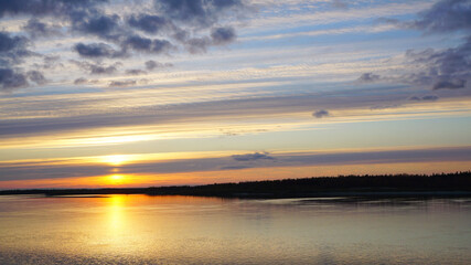 Naklejka premium landscape sunset river orange light clouds summer autumn