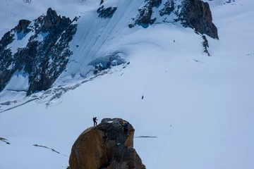 Crédence de cuisine en verre imprimé Mont Blanc Mountain landscape with alpinist climbing Aiguille du Midi at 3842m, Mont Blanc massif , French Alps, Chamonix, Haute Savoie region, France
