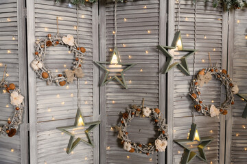 Beautiful bright location with a Christmas tree. Room decoration in New Year's style.