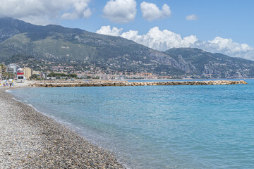 The beach of Menton with blue sea