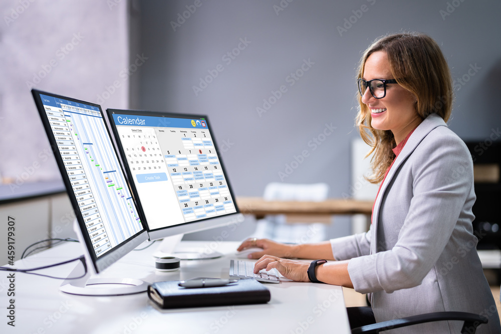 Aufkleber employees staff schedule and time reports on computer
