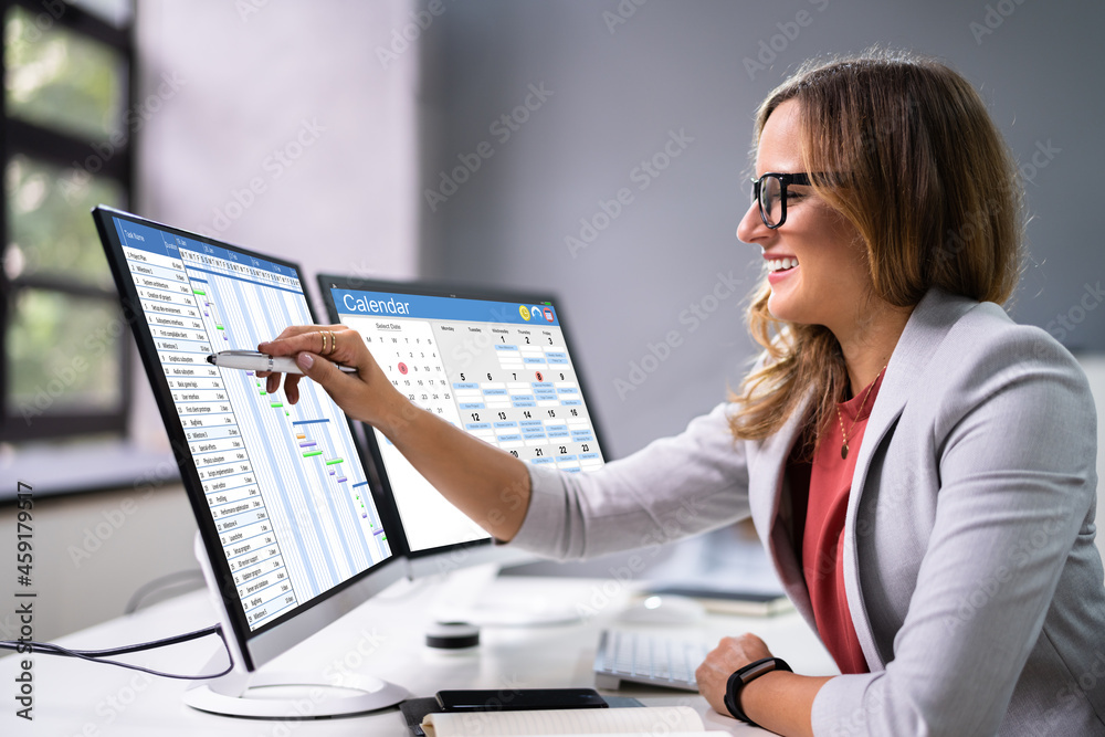 Aufkleber employees staff schedule and time reports on computer