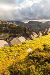Obraz premium View over slate quarry to lake and mountains, landscape, Unesco Heritage, portrait, wide angle.
