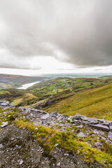 North Wales view from slate quarry,  hills and lakes in distance, portrait, copyspace.