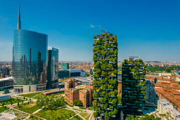 Aerial view of Vertical forest (Bosco Verticale) building in Milan. Residential buildings with many trees and other plants in balconies