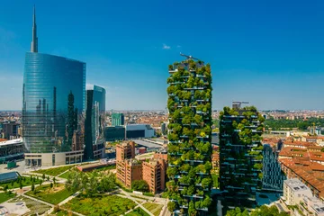 Fototapete Rund Aerial view of Vertical forest (Bosco Verticale) building in Milan. Residential buildings with many trees and other plants in balconies © Audrius
