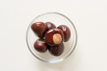 horse chestnuts in a glass bowl