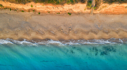 Empty tropical beach, and clear blue water. aerial view.