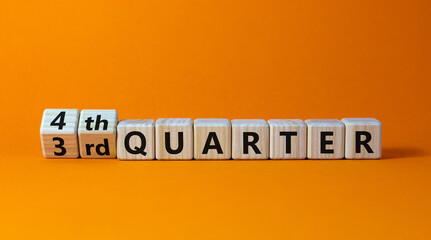 From 3rd to 4th quater symbol. Turned wooden cubes and changed words '3rd quater' to '4th quater'. Beautiful orange table, orange background. Business, happy 4th quater concept, copy space. - obrazy, fototapety, plakaty
