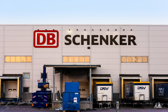 Company logo of DB Schenker on a logistics building..