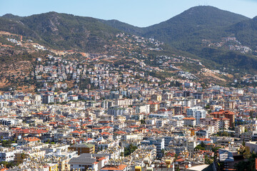 Fototapeta na wymiar A bird's-eye view of the Turkish city of Alanya on a bright sunny day.