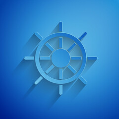 Obraz premium Paper cut Ship steering wheel icon isolated on blue background. Paper art style. Vector