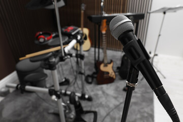 Modern microphone at recording studio, space for text. Music band practice